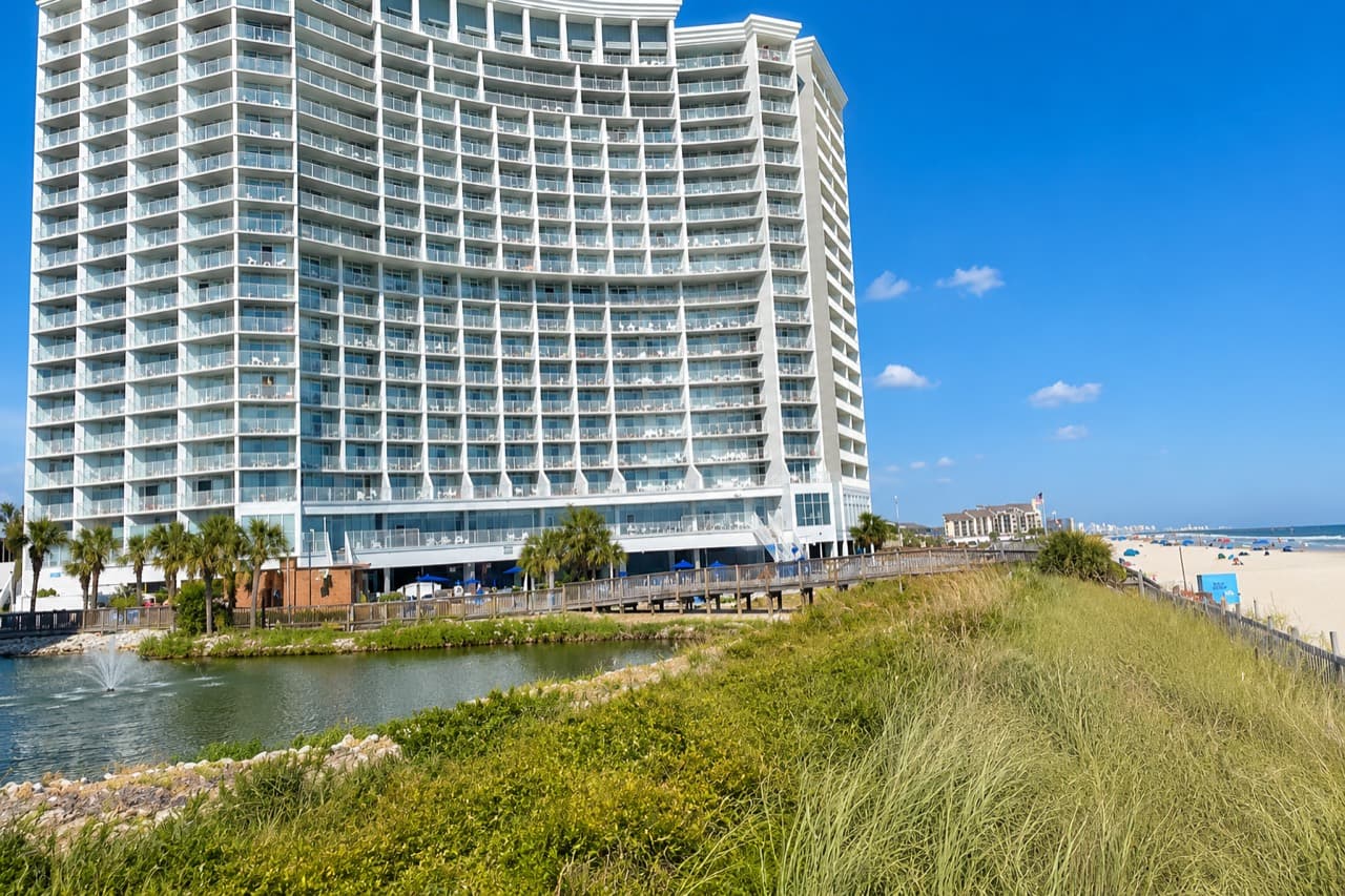 SeaWatch Resort oceanfront towers beside the beach and water features
